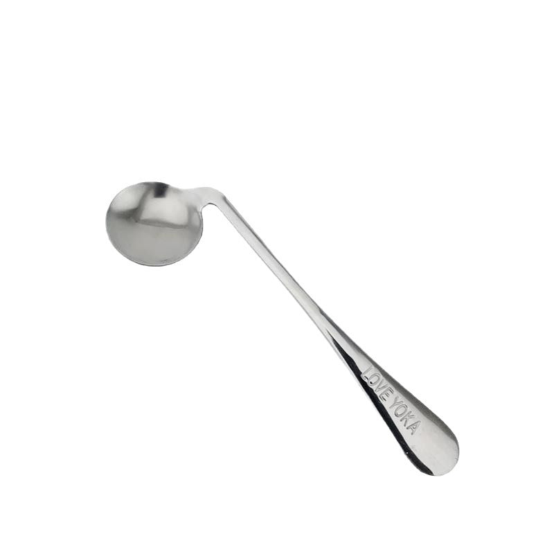 Hand holding angled fork, ideal for left hand users or stroke patients