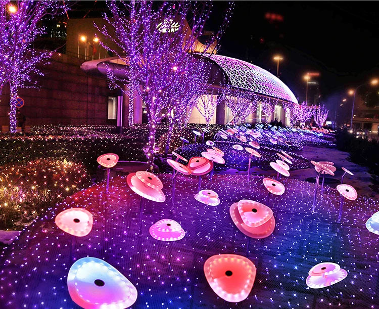 RGBIC LED fairy lights used as outdoor garden decoration with soft multicolor glow on the ground