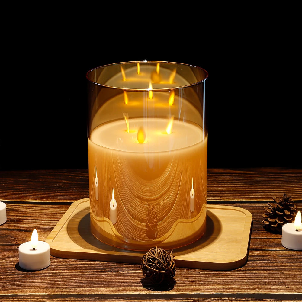 3-Wick Flameless LED Candle in gold glass holder glowing on wooden tray with pine cone decor, cozy home ambiance
