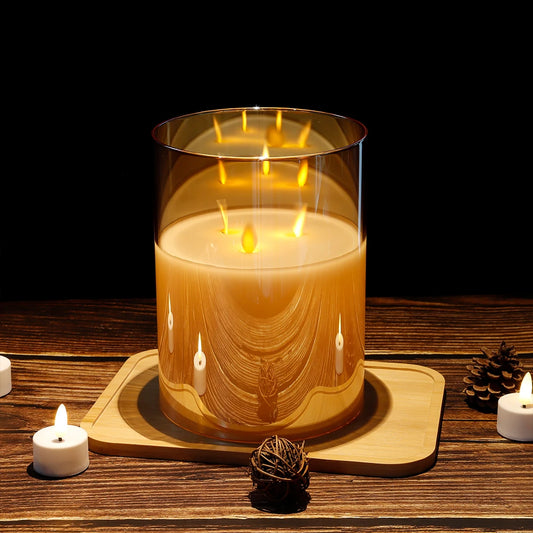 3-Wick Flameless LED Candle in gold glass holder glowing on wooden tray with pine cone decor, cozy home ambiance